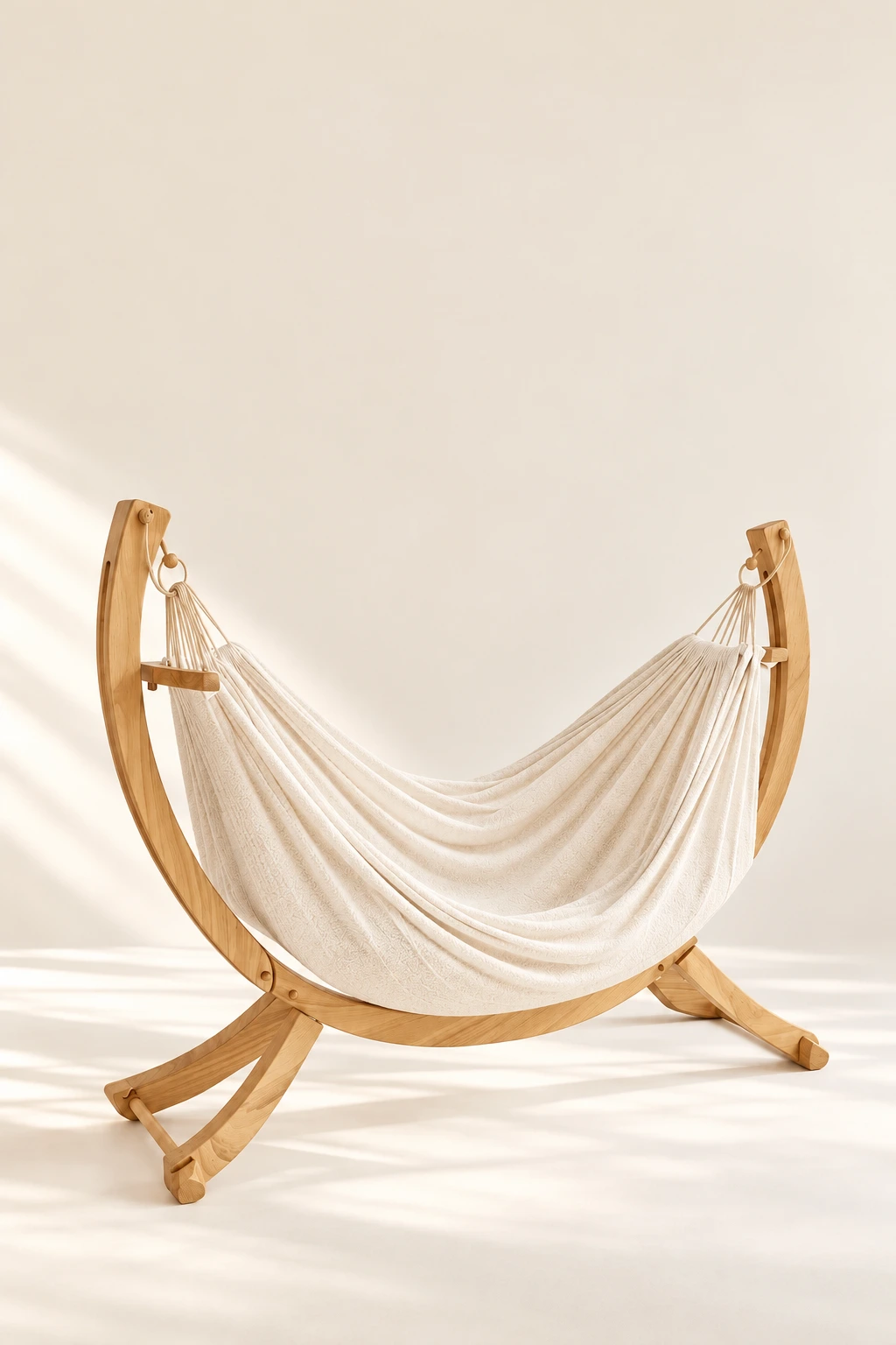The complete Cocoon curved oak stand and cream fabric sling
